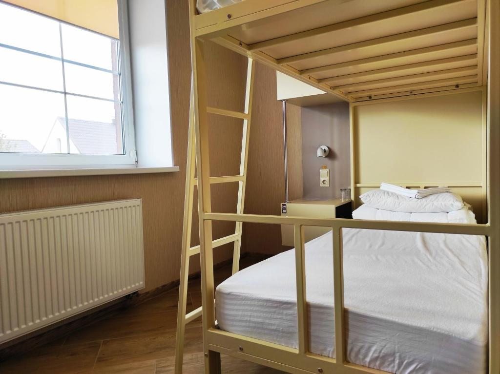 Номер (Спальное место на двухъярусной кровати в общем номере для женщин) хостела Hostel TAPIAU, Гвардейск