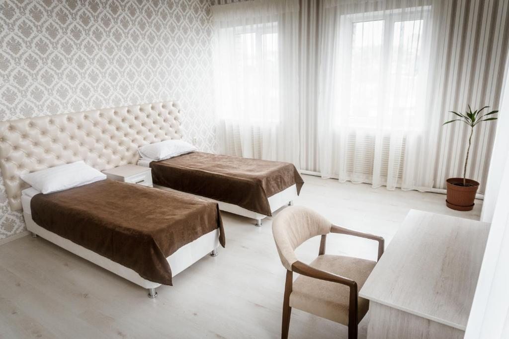 Двухместный (Просторный двухместный номер с 2 отдельными кроватями) отеля Золотой Дракон, Сызрань