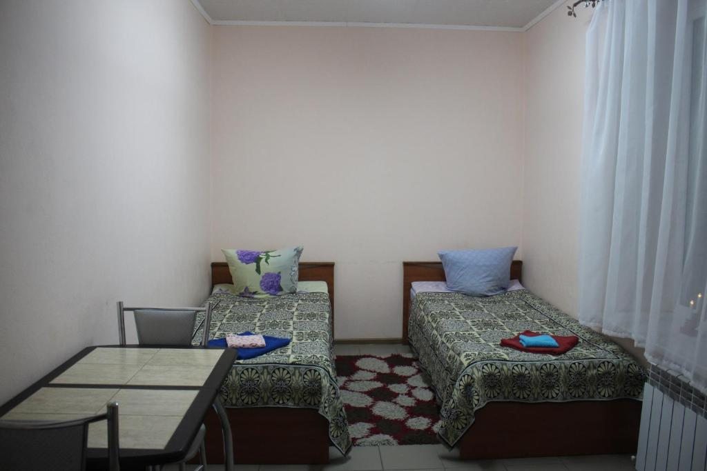 Двухместный (Бюджетный двухместный номер с 2 отдельными кроватями) гостевого дома Юлия, Рускеала, Республика Карелия