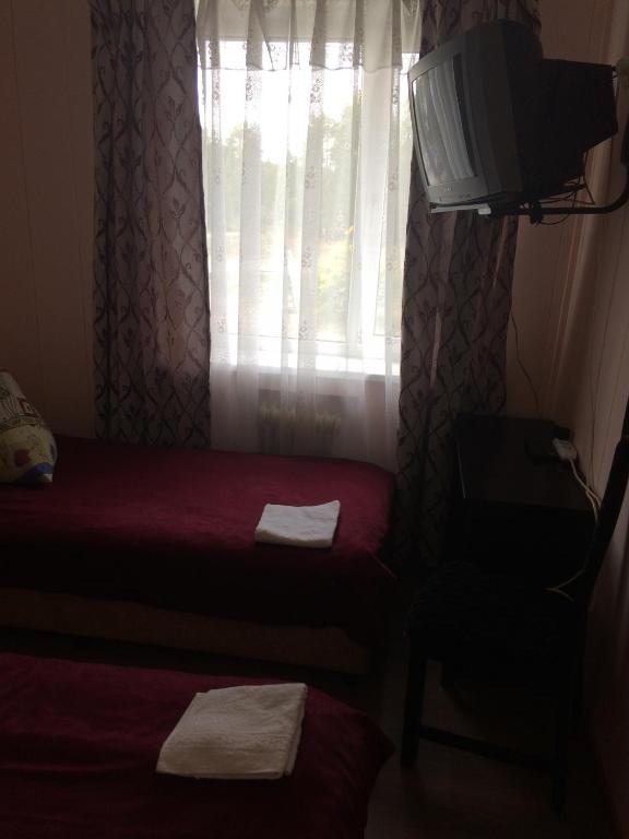 Двухместный (Двухместный номер с 2 отдельными кроватями и ванной) мотеля Inema Мотель, Лодейное Поле