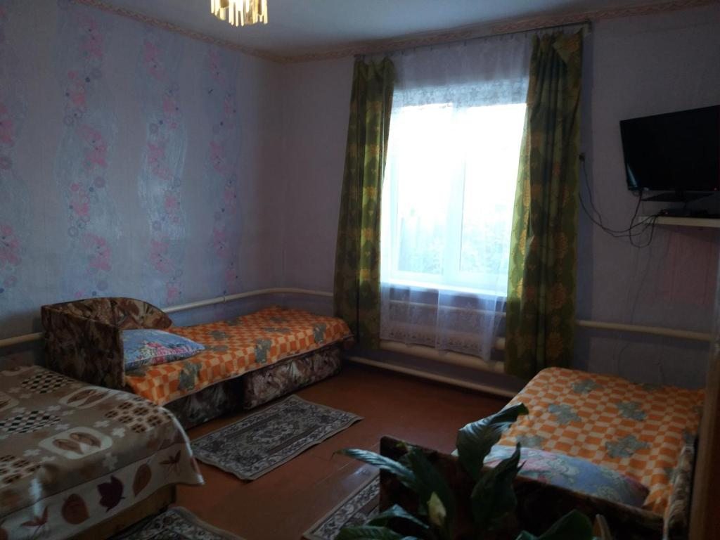 Четырехместный (Четырехместный номер с общей ванной комнатой) гостевого дома Наран, Большое Голоустное