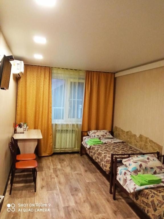 Двухместный (Двухместный номер с 2 отдельными кроватями и дополнительной кроватью) гостевого дома Рядом, Хабаровск