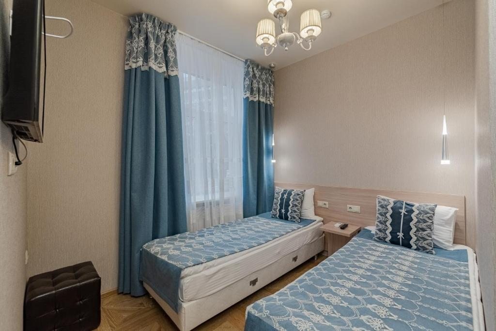 Двухместный (Стандартный двухместный номер с 2 отдельными кроватями) мини-отеля Дюжина, Москва