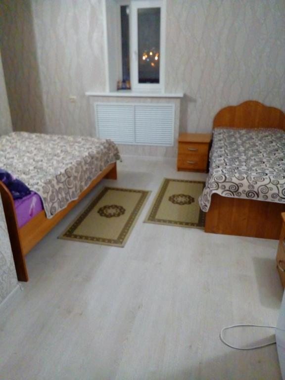 Двухместный (Двухместный номер с 2 двуспальными кроватями) отеля На Невской 33, Тюмень