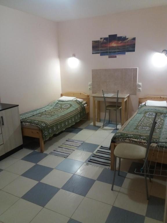 Двухместный (Бюджетный двухместный номер с 2 отдельными кроватями) семейного отеля Комнаты в Песочном, Песочный