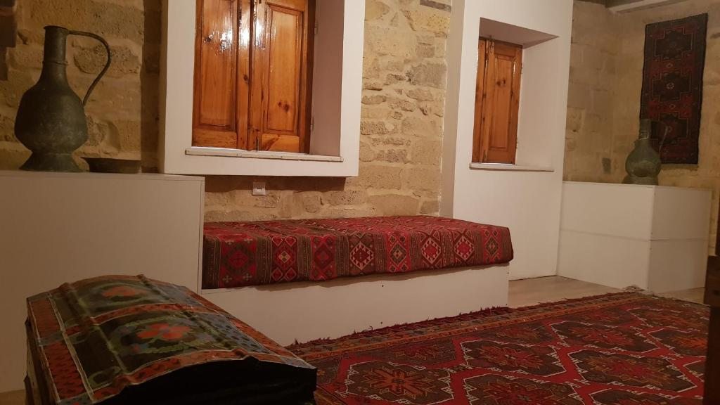Номер (Спальное место на двухъярусной кровати в общем номере для мужчин и женщин) хостела Этнохостел в Дербенте