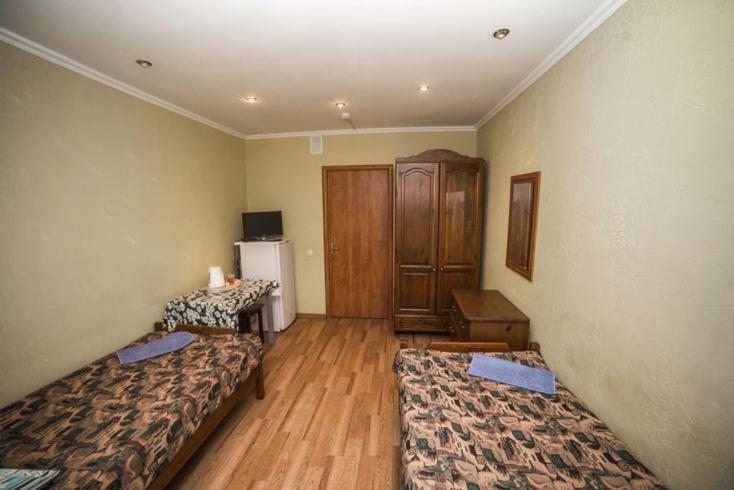 Двухместный (Бюджетный двухместный номер с 2 отдельными кроватями) мини-гостиницы Berezka Inn, Кимры