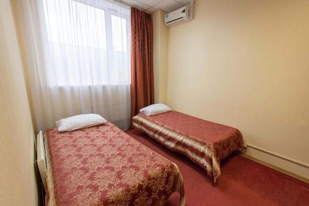 Двухместный (Двухместный номер с 2 отдельными кроватями и общей ванной комнатой) отеля На Южной, Москва