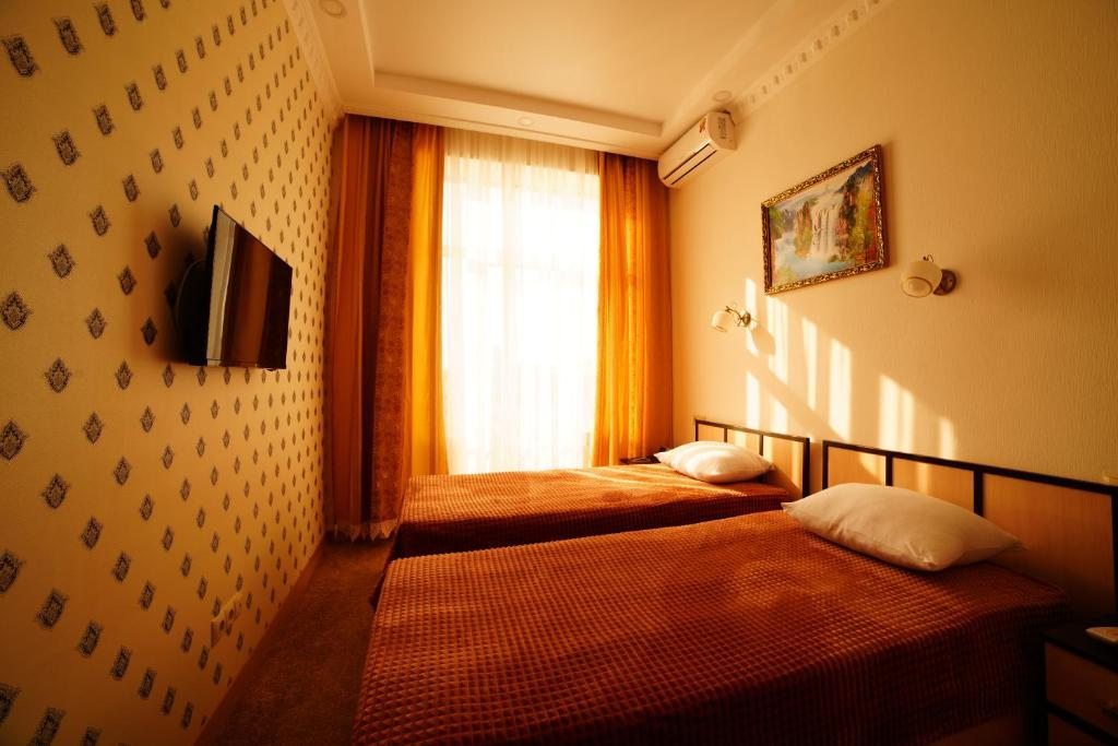 Двухместный (Двухместный номер с 2 отдельными кроватями и душем) отеля Рафаэль, Нальчик