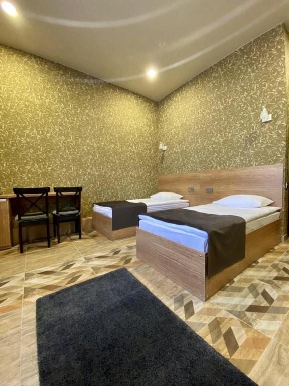 Двухместный (Двухместный номер Делюкс с 2 отдельными кроватями) мини-отеля Venezia, Юрга