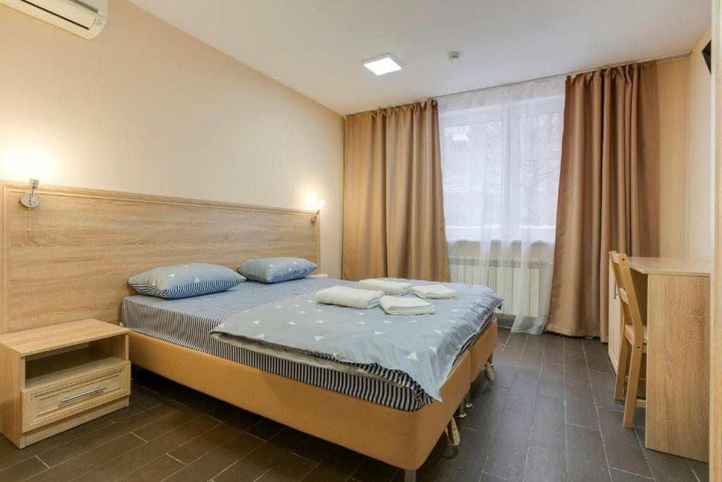 Двухместный (Улучшенный двухместный номер с 1 кроватью или 2 отдельными кроватями) мини-отеля Ладомир Болотниковская, Москва