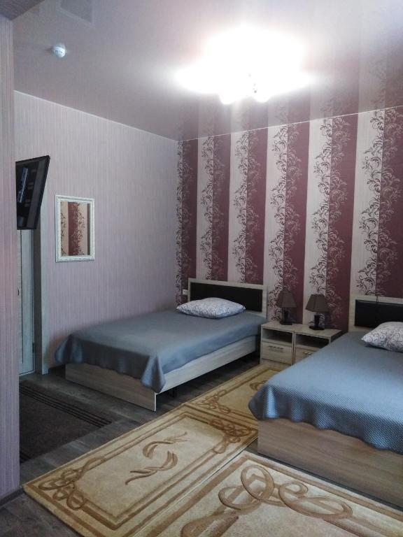 Двухместный (Просторный двухместный номер с 2 отдельными кроватями) мини-гостиницы Урал, Губаха