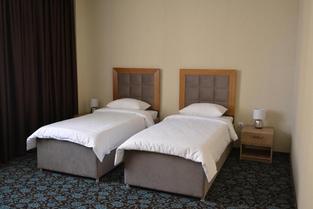 Двухместный (Стандартный двухместный номер с 2 отдельными кроватями) отеля Гостиничный комплекс 