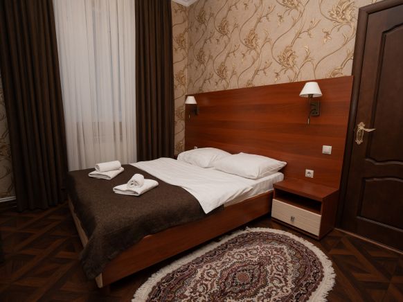 Фотография номера мини отеля Снежная Королева Домбай