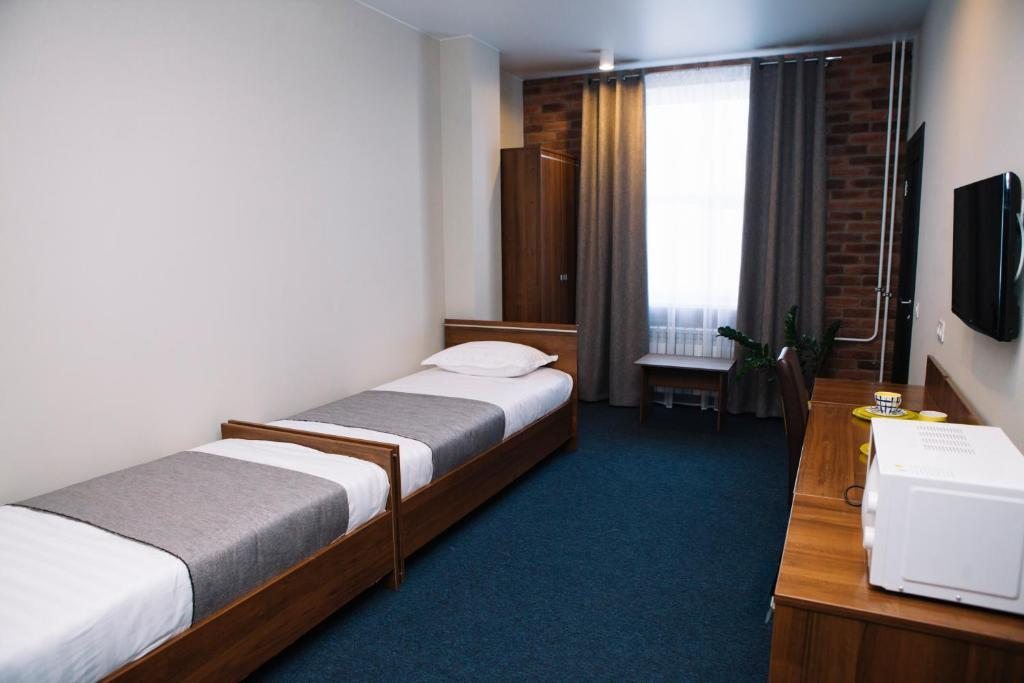 Двухместный (Двухместный номер с 2 отдельными кроватями и собственной ванной комнатой) отеля Автостоп, Южноуральск