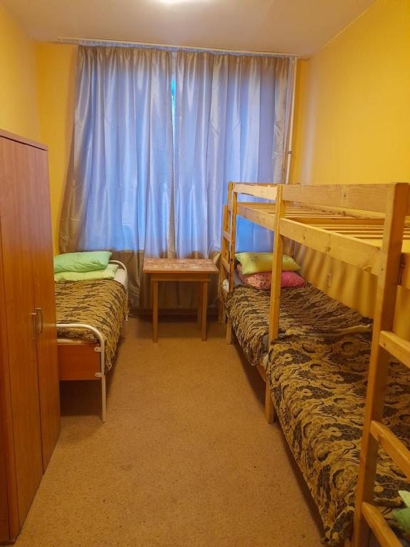 Номер (Односпальная кровать в общем номере) хостела Альянс, Архангельск