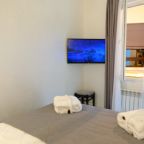 Двухкомнатный номер с сауной и джакузи. Спальня