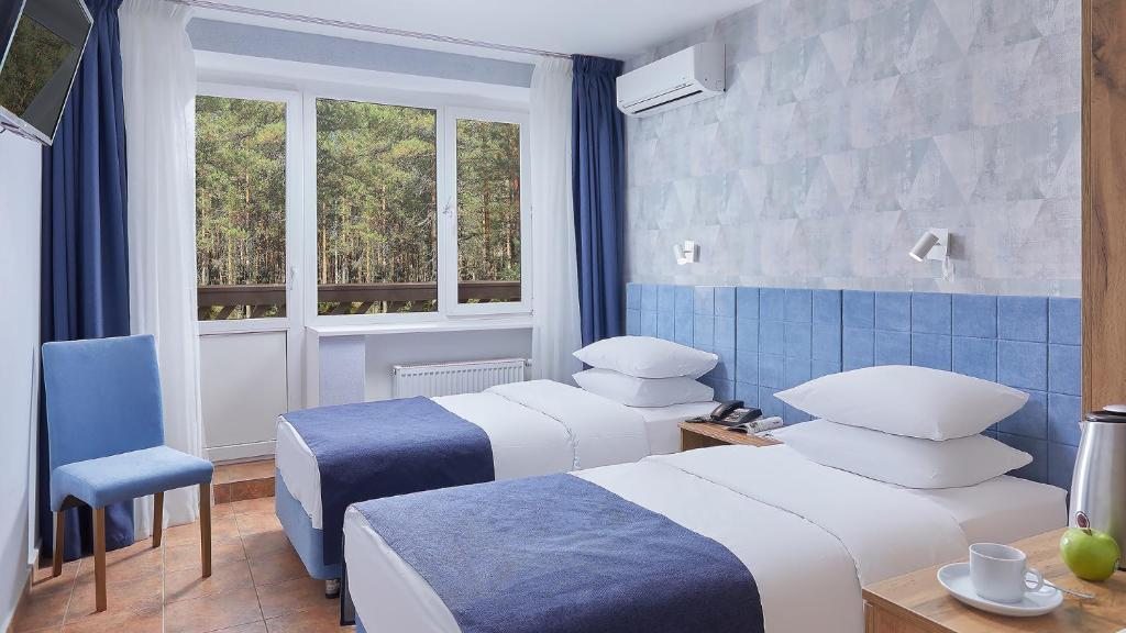 Двухместный (Стандартный двухместный номер с 2 отдельными кроватями) отеля Country Resort, Вербилки