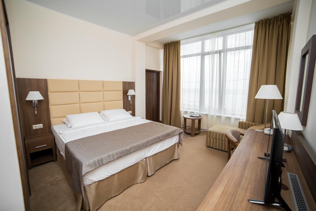 Двухместный (Двухместный номер с 1 двуспальной кроватью и дополнительной кроватью) отеля SunRise на Приморской, Небуг