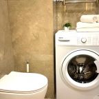 Ванная комната. Стиральная машина.  Набор полотенец.