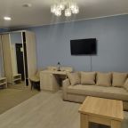 Двухместный диван,стол, настольная лампа, шкаф-купе,стул.