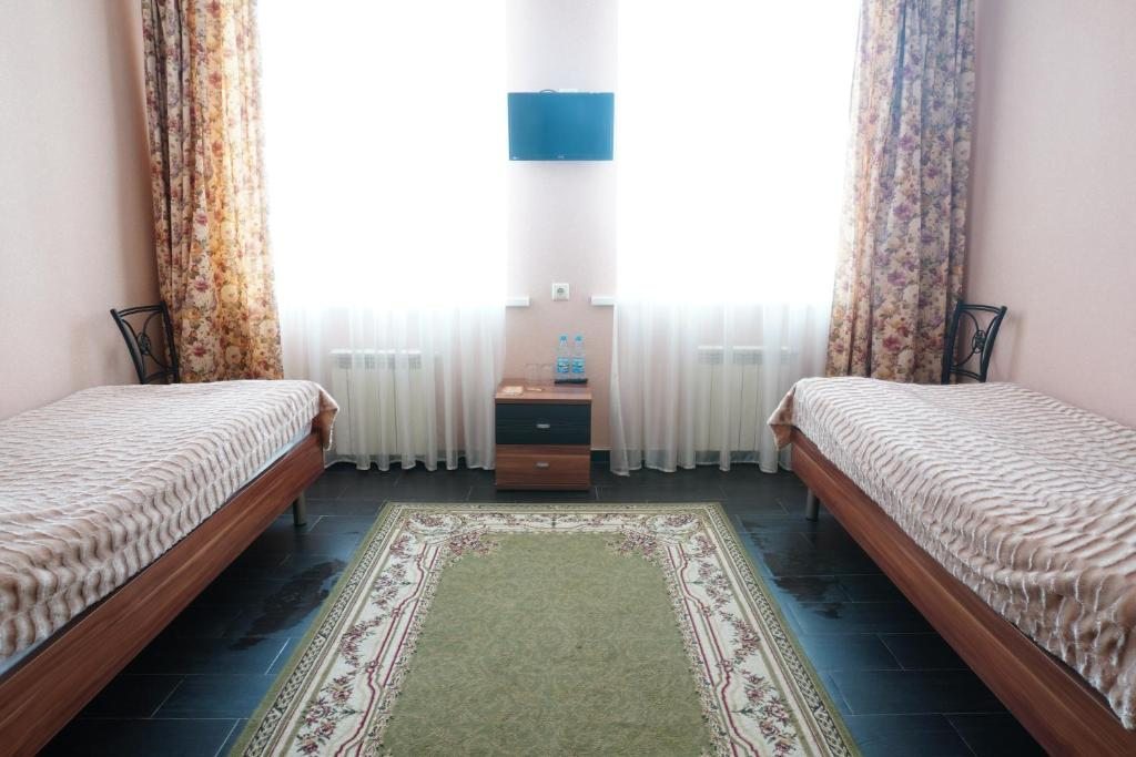 Двухместный (Двухместный номер Делюкс с 2 отдельными кроватями) отеля Лазурное, Суровикино