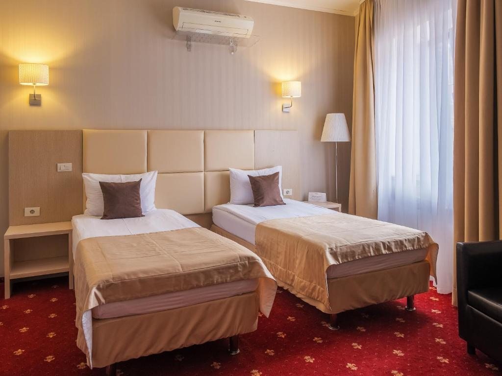 Двухместный (Улучшенный двухместный номер с 1 кроватью или 2 отдельными кроватями) отеля Премьер, Смоленск