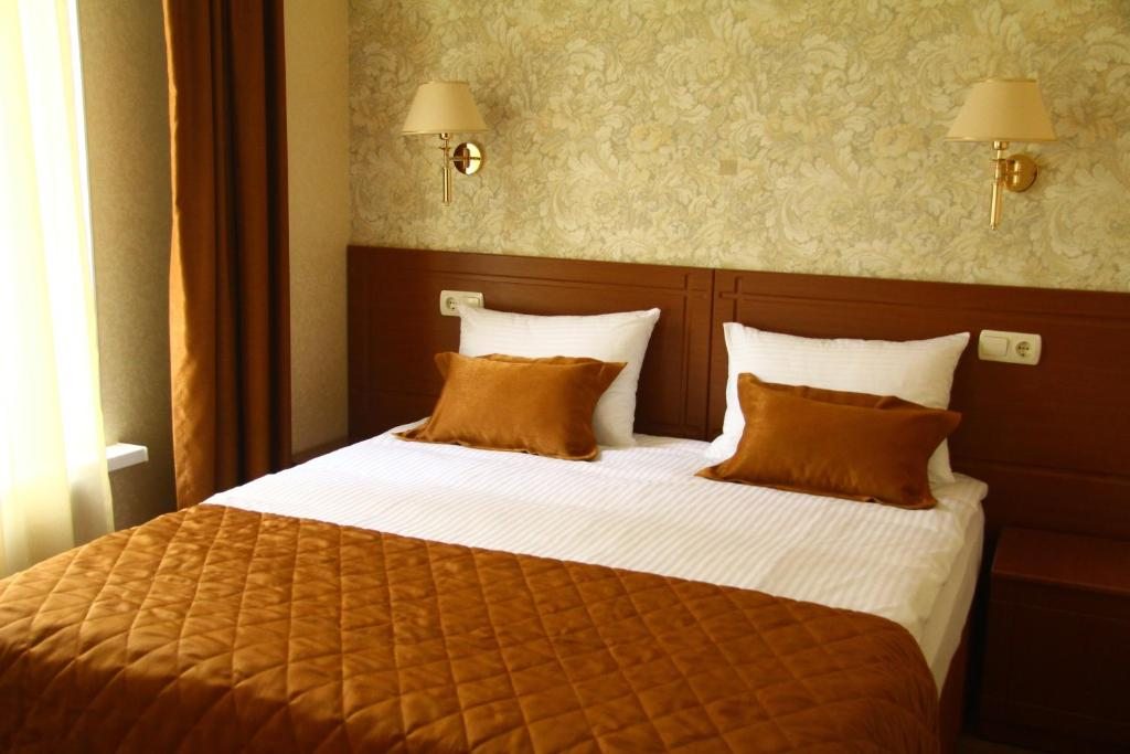 Двухместный (Двухместный номер Делюкс с 1 кроватью или 2 отдельными кроватями) отеля Тепло, Абинск