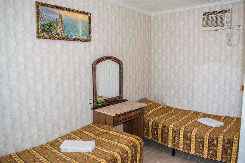 Двухместный (Стандартный двухместный номер с 2 отдельными кроватями) гостевого дома Арина, Лоо