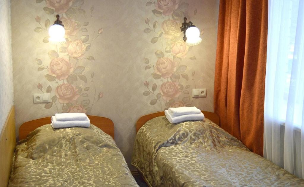 Двухместный (Стандартный двухместный номер с 2 отдельными кроватями и душем) отеля Волгореченск