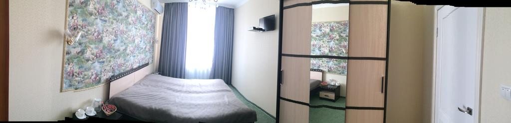 Двухместный (Улучшенный двухместный номер с 2 отдельными кроватями) мини-отеля Надежда, Каневская