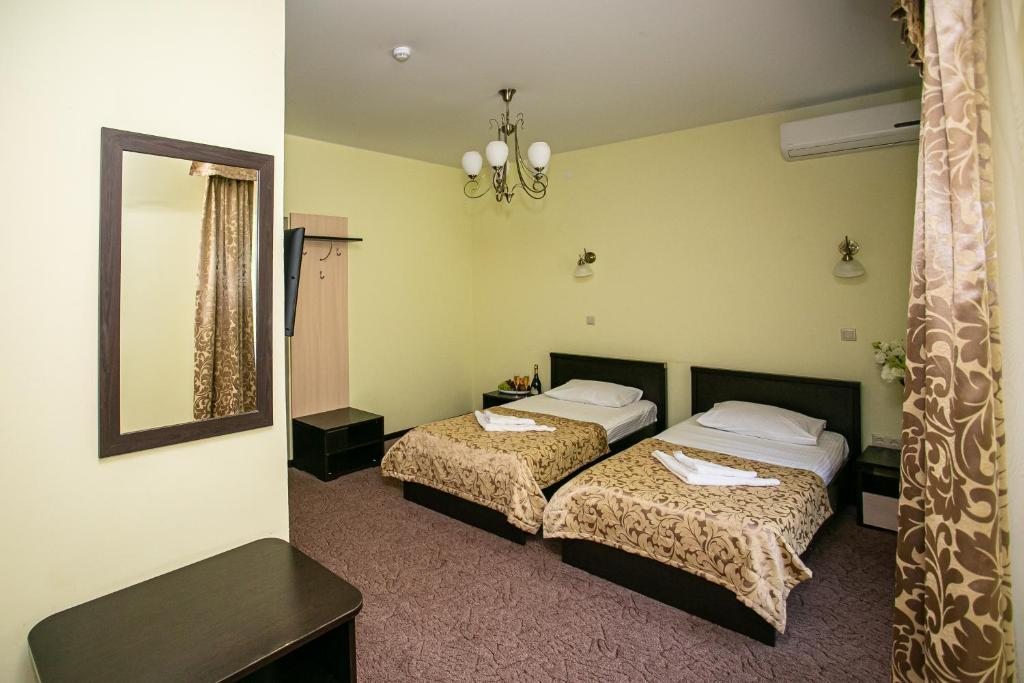 Двухместный (Стандартный двухместный номер с 2 отдельными кроватями) отеля Леона, Гагра