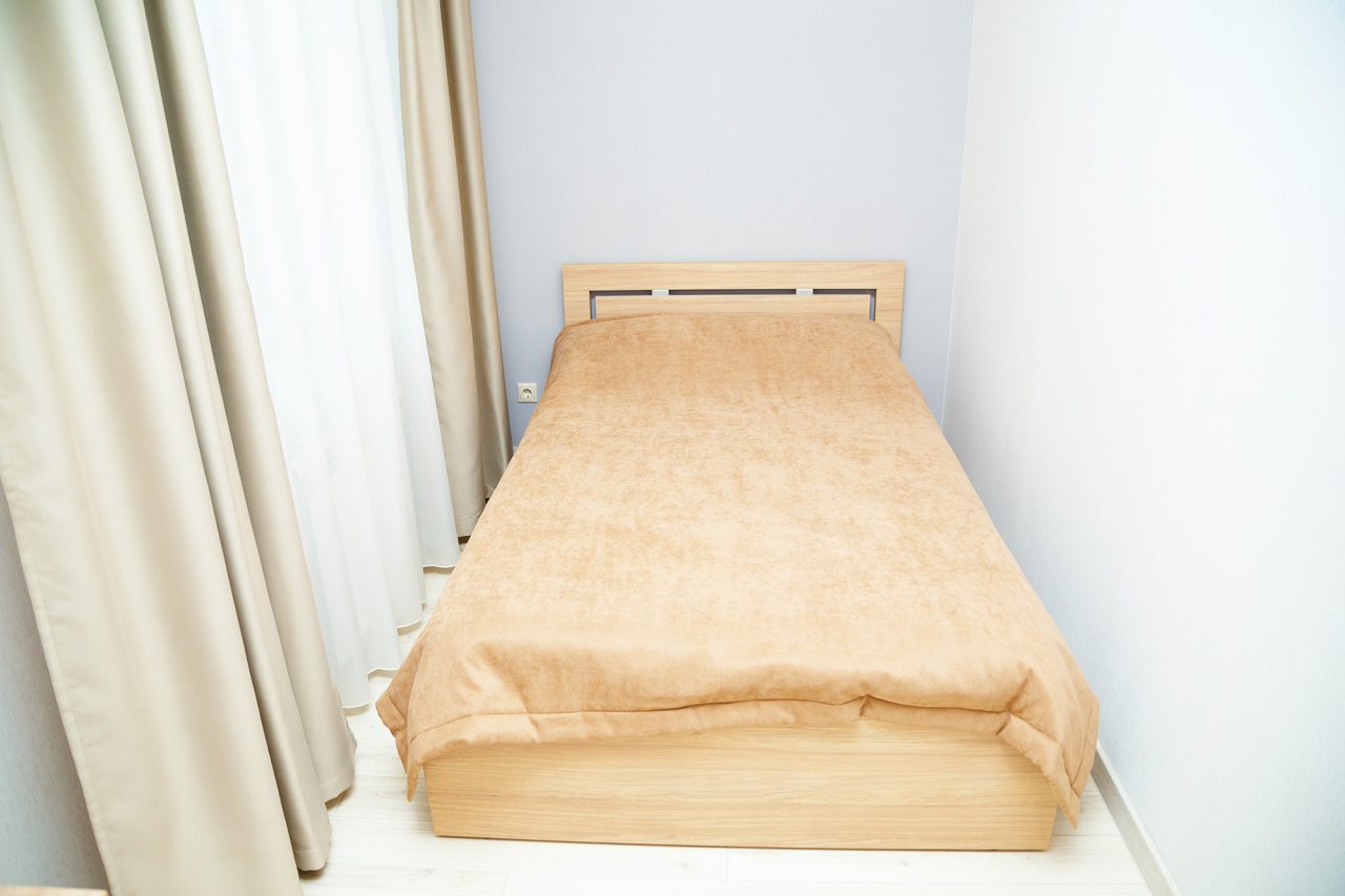 Спальная комната в номере 5 Люкс