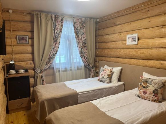 Фотография номера гостиницы Удивительная Деревня Мандроги