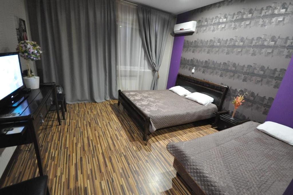 Трехместный (Стандартный трехместный номер с двуспальной и 1 односпальной кроватями) отеля Villa Vita, Голубицкая