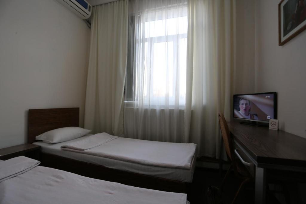 Двухместный (Двухместный номер эконом-класса с 2 отдельными кроватями) отеля Sakura, Фергана