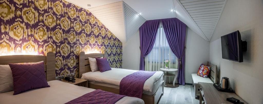 Двухместный (Улучшенный двухместный номер с 2 отдельными кроватями) отеля Aster Hotel Group, Ташкент