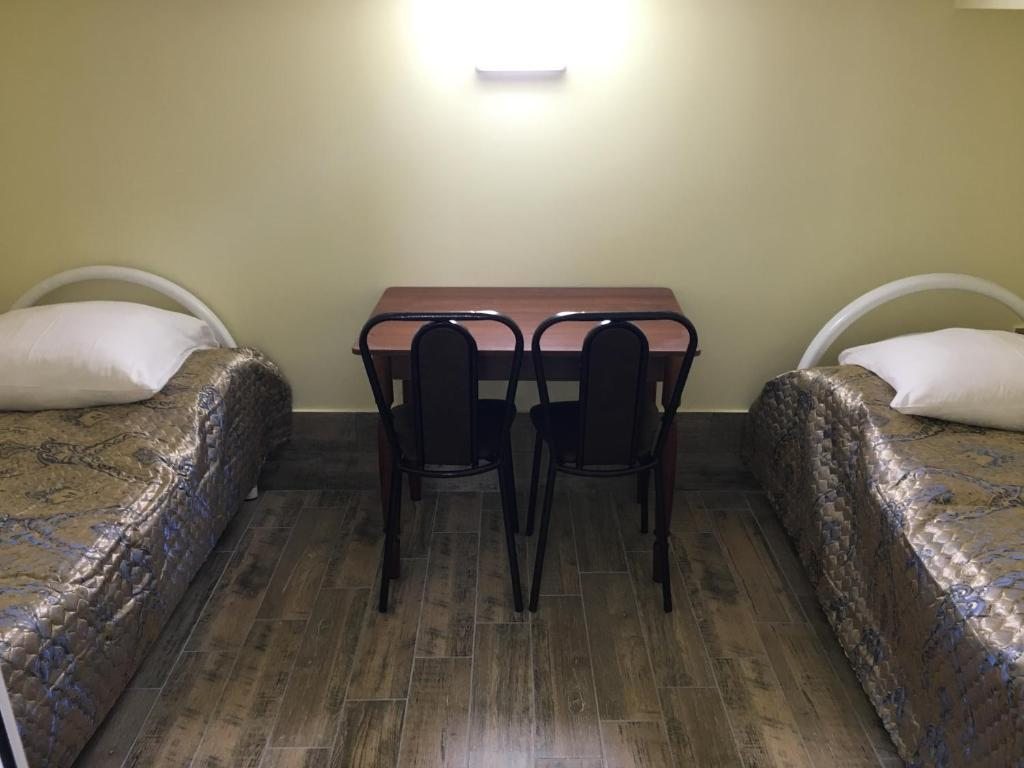 Двухместный (Двухместный номер с 2 отдельными кроватями и общей ванной комнатой) отеля Yug Soyl, Нововоронеж