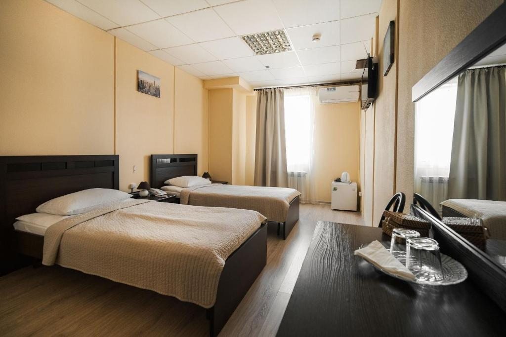 Двухместный (Стандартный двухместный номер с 2 отдельными кроватями) отеля Континент, Тобольск