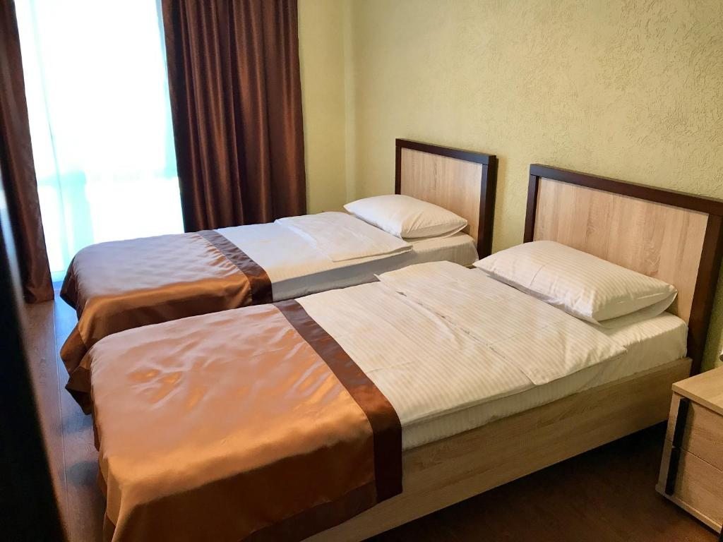 Двухместный (Просторный двухместный номер с 2 отдельными кроватями) отеля Мандарин, Лдзаа