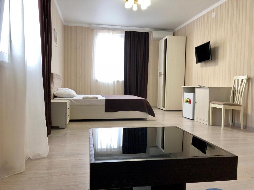 Семейный (Семейный люкс с 2 комнатами) отеля Мандарин, Лдзаа