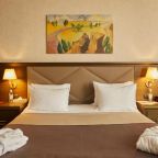 Кровать в номере отеля SK Royal 5*, Тула