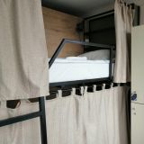 Удобная кровать с полочками и занавесками