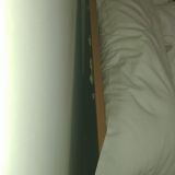 Изголовье кровати всё облеплено жвачкой